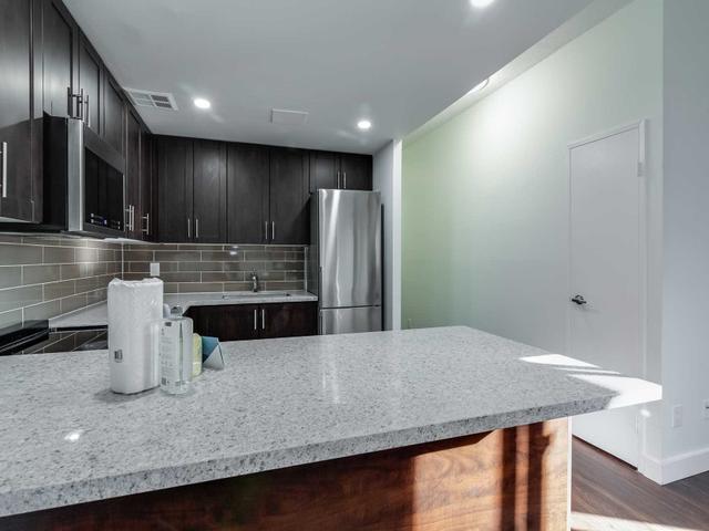 209 - 57 Charles St W