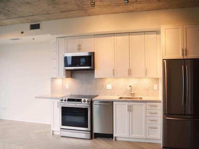 702 - 630 Queen St E