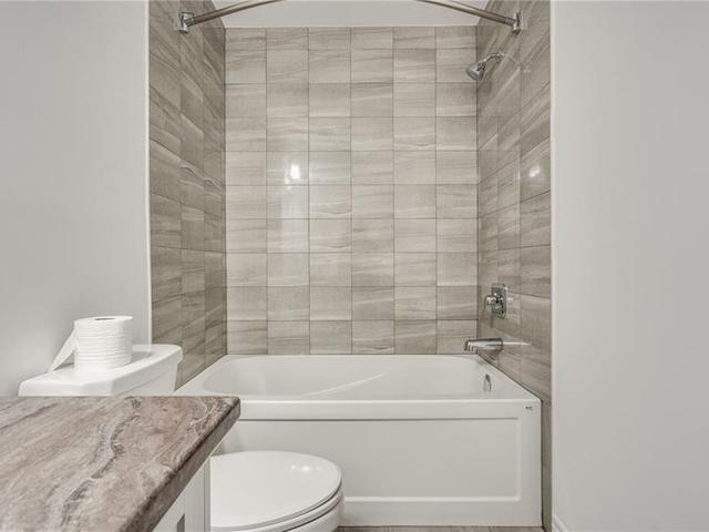 105 - 575 Woodward Avenue