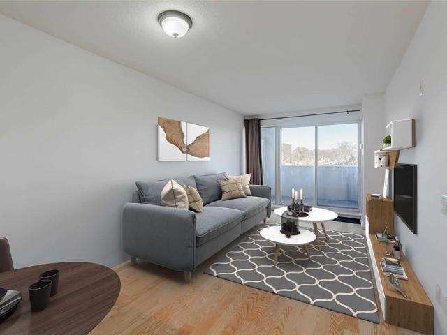 203 - 1040 The Queensway