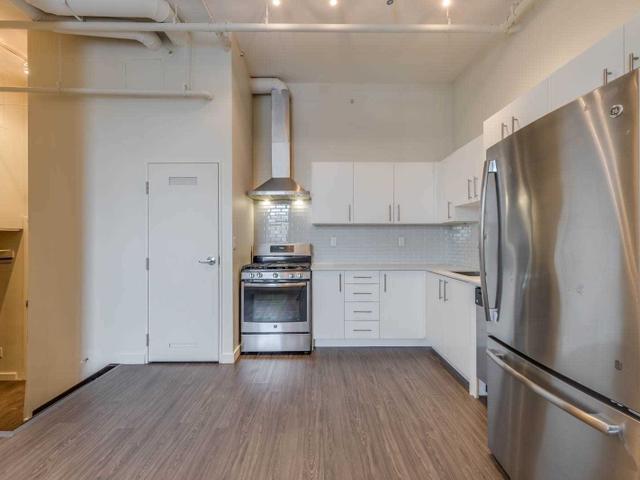 PH403 - 1496 Queen St W