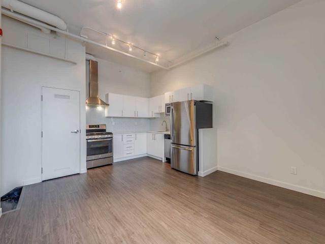 PH403 - 1496 Queen St W